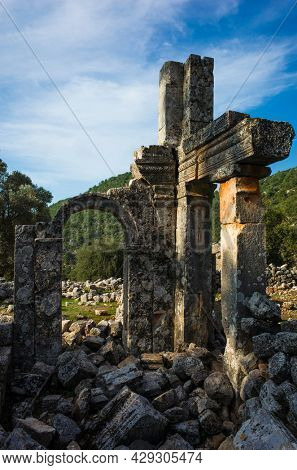 Alakilise ruins along Lycian way hiking trail, wall with arch remains of Alakilise or Church of the Angel Gabriel in Lycia, near Finike and Demre, Antalya Province, Turkey