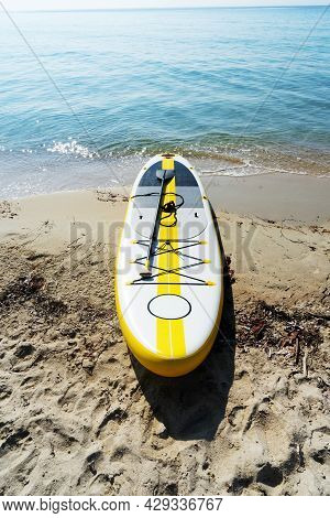 Empty Seaside Landscape Sea Sand Beach With Supboard On Coast Calm Wave Water Surface