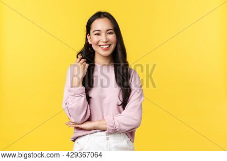 People Emotions, Lifestyle And Fashion Concept. Laughing Asian Girl, Casualy Talking, Touching Hair 