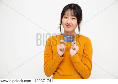Young Beautiful Asian Woman Smiling, Showing, Presenting Credit Card Isolated On White Background, C