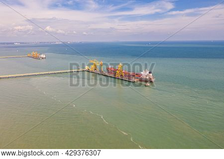 A Coal Transport Ship At The Dock Of The   Jimah Power Plant At The Malaysia West Coast. An Aerial V
