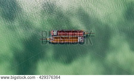 Old Fishing Boats On The Sea Off The Coast Of Malaysia From The Sky. Aerial View To Two Old Wooden M