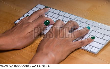 Woman Hands Typing On A Computer Keyboard. Female Hands Writing On A Aluminum Computer Keyboard. Fin