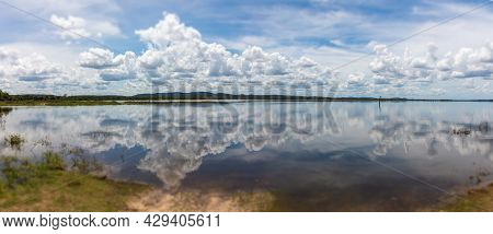 Water Mirror Effect On The Minneriya Wewa Lake At The Minneriya National Park , Sri Lanka. Cloudscap