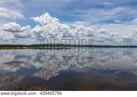 Water Mirror Effect On The Minneriya Wewa Lake At The Minneriya National Park , Sri Lanka. Cloudscap
