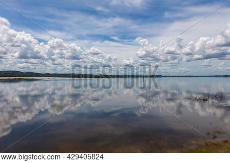 Water Mirror Effect On The Minneriya Wewa Lake At The Minneriya National Park , Sri Lanka. Cloudscap