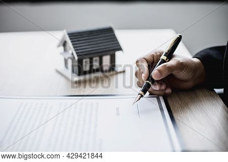 The Salesperson Is Checking The Contract Before Making An Appointment For The Customer To Join The C