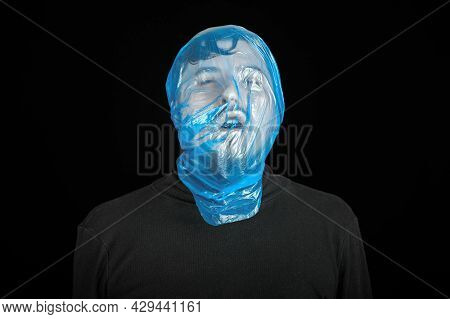 Suicide Bag On Man Head. Exit Bag For Suicide. Self-asphyxiation Concept. Garbage Bag On Head. Short
