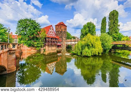 Nuremberg, Germany. The Wine Warehouse (weinstadel) And Hangman's Bridge (henkersteg) On The Banks O
