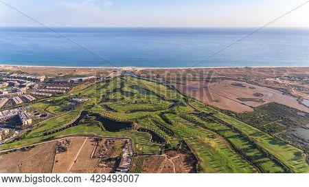 Green Golf Courses By The Sea. Salgados Beach. Portugal, Albufeira. Aerial View.