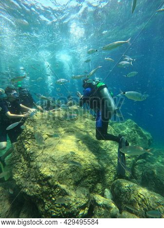 Tourists scuba dive Mediterranian Sea. Marmaris,Turkey.