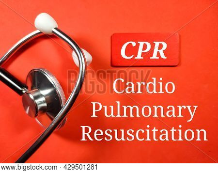 Medical Concept.text Cpr (cardio Pulmonary Resuscitation) With Stethoscope On Red Background.