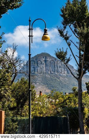 Sorrento, Italy - August 26 2020: Street View To Monte Vico Alvano Mountain With Big Cross On Top