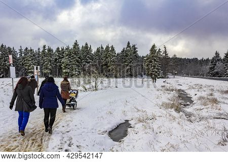 Hikers People In Snowed In Landscape Brocken Mountains Harz Germany.