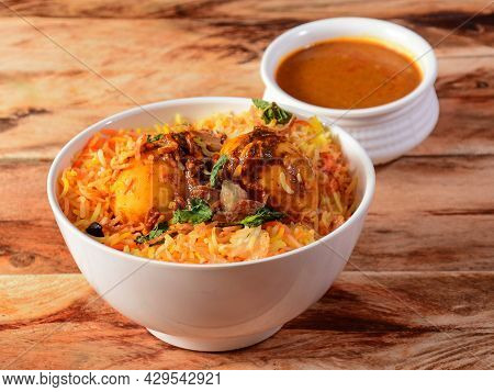 Egg Biryani - Basmati Rice Cooked With Masala Roasted Eggs And Spices And Served With Mirchi Ka Sala