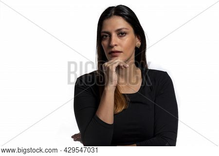 Young Business Latina Woman Isolated Against A White Background Confident, Touching Chin With Hand.