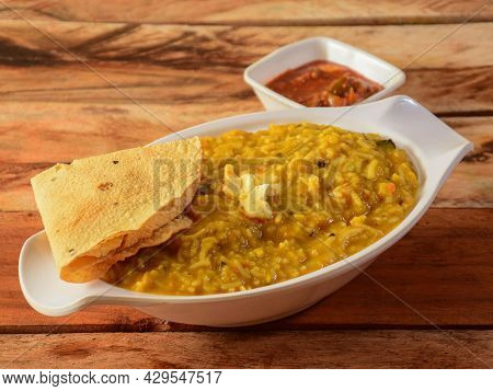 Dal Khichdi Or Khichadi, Tasty Indian Recipe Served In Bowl Over Rustic Wooden Background, The Food 