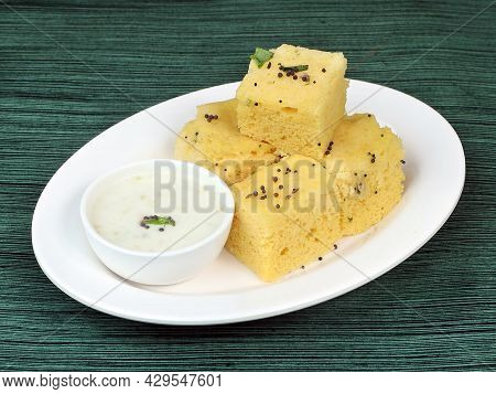 Indian Gujarati Khaman Dhokla Made Using Dal, Served With Chutney, Selective Focus