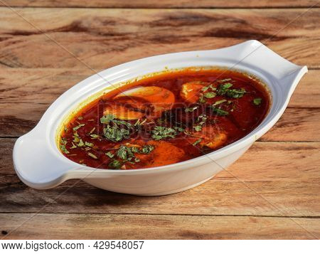 Anda Masala Or Egg Curry Is Popular Indian Spicy Food, Served In A Ceramic Bowl Over Rustic Wooden B