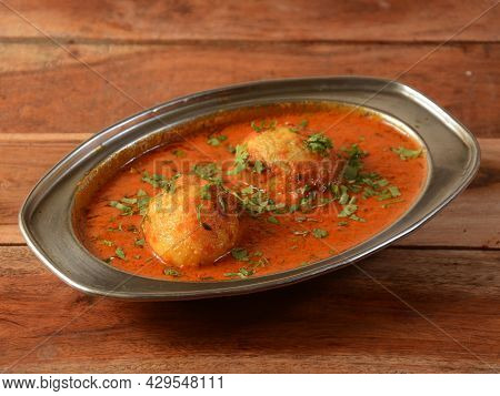 Anda Masala Or Egg Curry Is Popular Indian Spicy Food, Served In A Ceramic Bowl Over Rustic Wooden B
