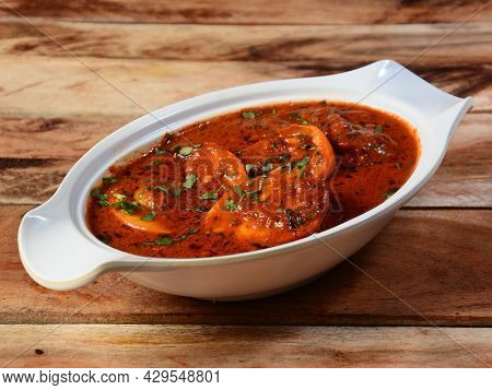 Anda Masala Or Egg Curry Is Popular Indian Spicy Food, Served In A Ceramic Bowl Over Rustic Wooden B
