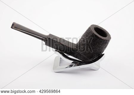 Biautiful Pipe On A Stand On White Background