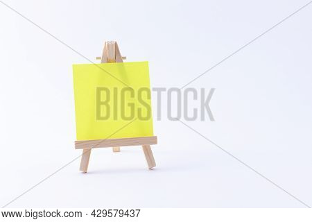 Wooden Easel Miniature With Blank Colored Square Canvas Or Memo Paper - Mockup. Mini Wooden Stand Wi