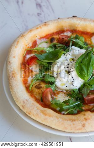 Buratta Cheese On A Neapolitan Pizza On A Cafe Table
