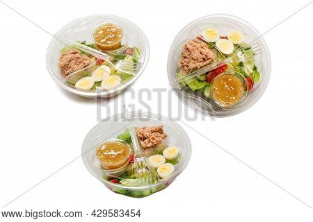 Fresh Tuna Salad With Lettuce, Cucombers, Cherries And Eggs In Plastic Container.  Top View.