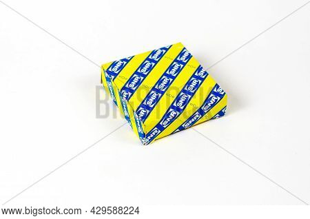 New Ball Bearing In A Square Paper Yellow And Blue Box On A White Background. Auto Part Manufactured
