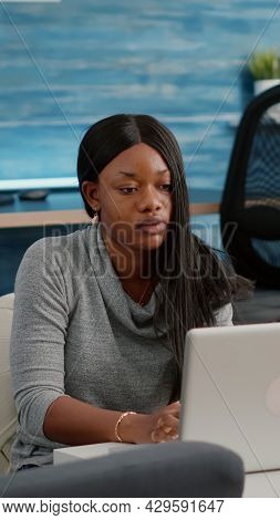 Blogger Student With Dark Skin Working From Home Browsing Communication Information While Drinking C