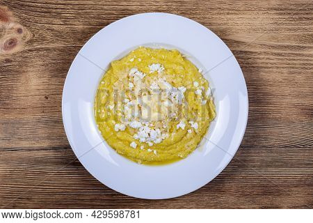 Kulesha - Hutsul Corn Porridge, Cooked On Water, Served With Cheese, Butter, Cheese And Sour Cream O