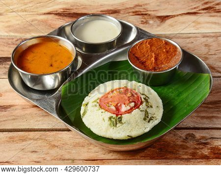 Rava Idli Or Semolina Idli Or Steamed Cake Traditional Indian Breakfast, Served With Chutney And Sam