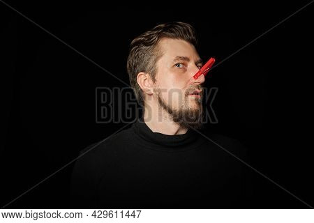 Bearded Man With Clothespin On Nose. Bad Stink, Funny Prankster, Joke Concept. Laugh At Yourself. Re