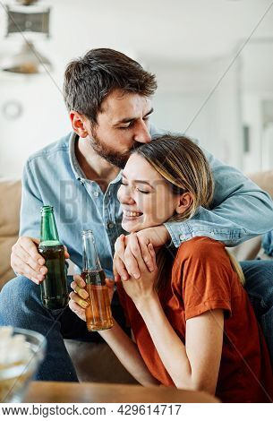 A Young Couple Having Fun Together At The Party Or At Home