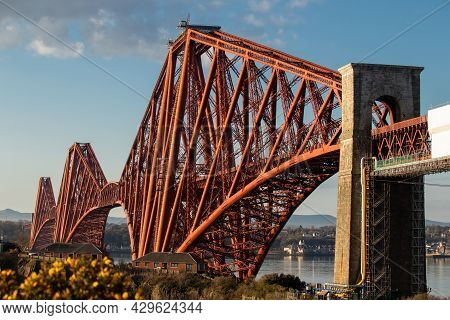 The Forth Rail Bridge Dominates The Landscape Above North Queensferry As It Marches Over The River F