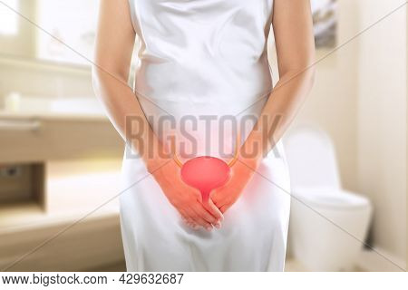 Women Having Urethritis And Urinary Incontinence. Female With Hands Holding Her Crotch