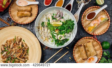 Assorted Asian Dinner, Vietnamese Food. Pho Ga, Pho Bo, Noodles, Spring Rolls Top View