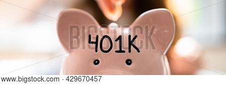 401k Plan Investing. Financial Advisor And Piggybank