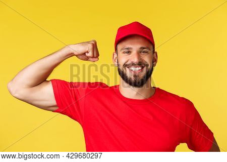 Close-up Of Confident And Cheerful Delivery Guy Showing How Storng He Is, Can Carry Huge Heavy Packa