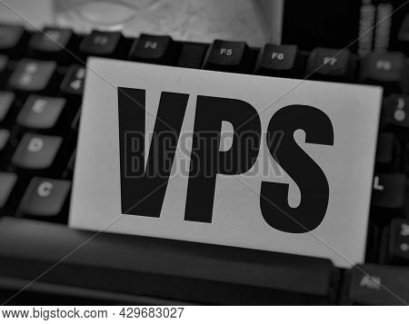 Selective Focus Text Vps On White Card With Keyboard.