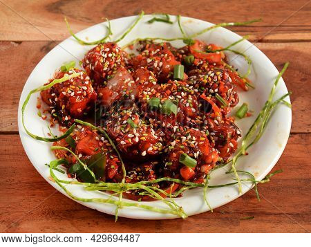 Paneer Schezwan Fry, Is A Famous Indo Chinese Dish, Served Over A Rustic Wooden Background, Selectiv