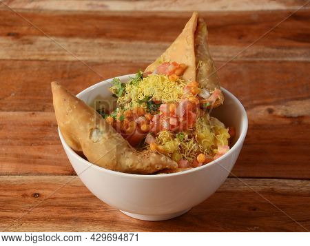 Samosa Chaat, Indian Special Traditional Street Food Served Over A Rustic Wooden Background, Selecti