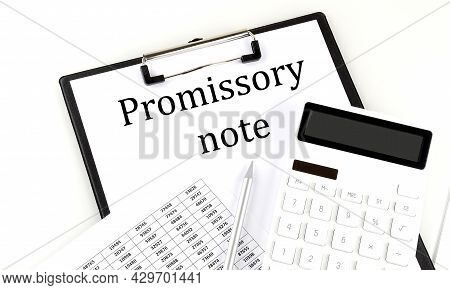 Promissory Note Text On Folder With Chart And Calculator On White Background