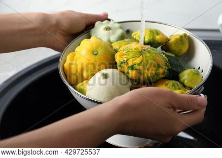 Woman Washing Pattypan Squashes Above Sink, Closeup