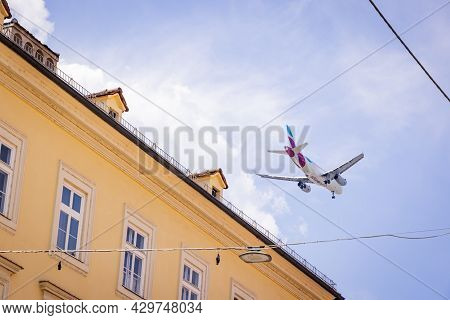 Airplane Flies Low Over The City Of Innsbruck - Innsbruck, Austria - July 29, 2021