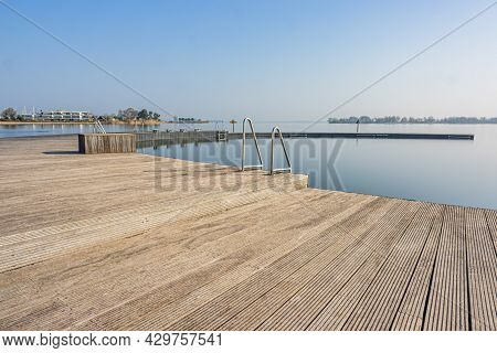 Wooden Platform Or Atoll With Metal Stairs In Natural Swimming Pool At Woldstrand Zeewolde Beach Rec