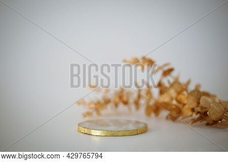 Marble Podium With Golden Leaves On The White Background. Podium For Product, Cosmetic Presentation.