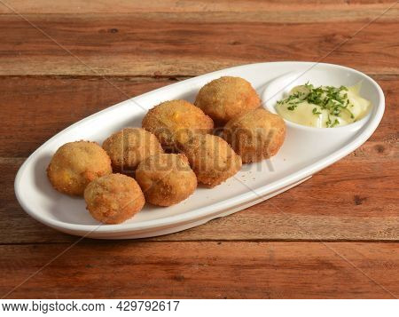 Indian Style Mushroom Stuffed With Mixture Of Cheese, Onion, Bread Crum