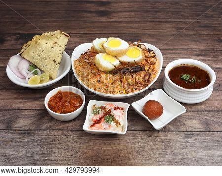 Egg Biryani Thali - Basmati Rice Cooked With Masala Roasted Eggs And Spices And Served With Mirchi K